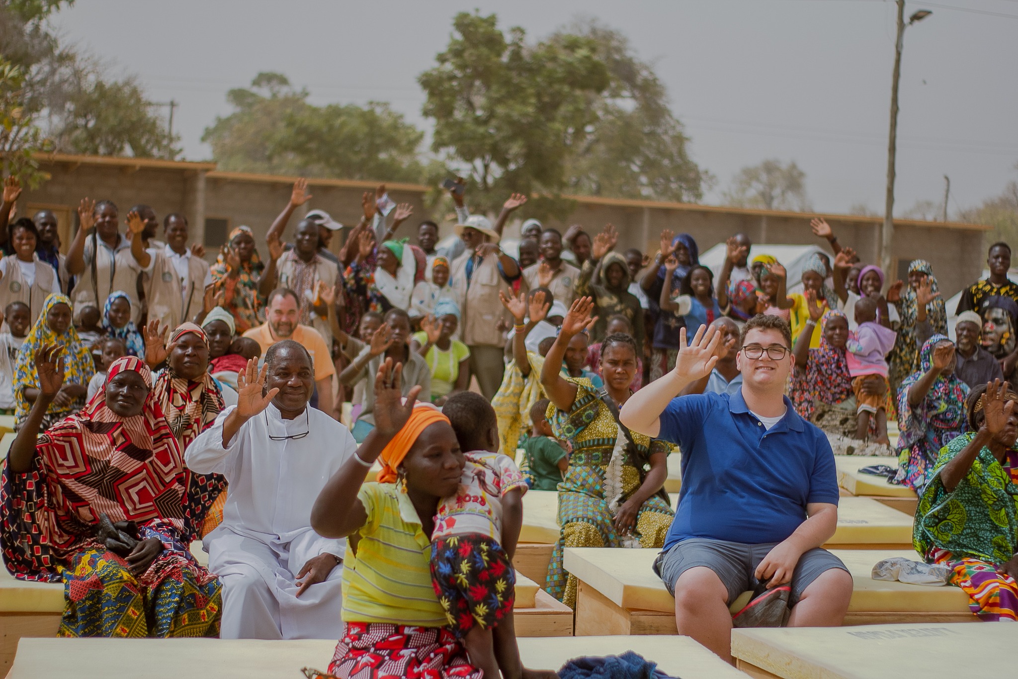 Joseph and crowd waving as picure is taken